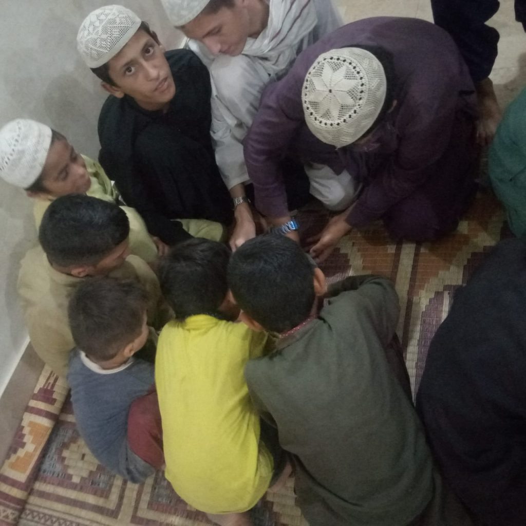 Children eating rice to break their Ramadan fast.